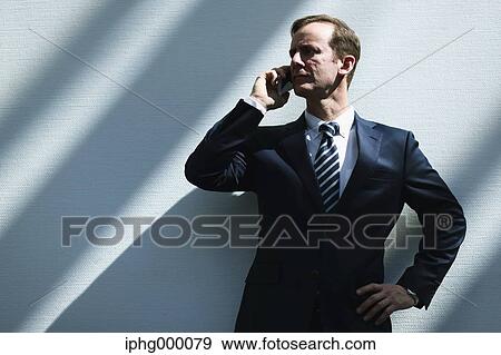 Caucasian businessman on the phone in modern office View Large Photo Image Stock Photo - Caucasian businessman on the phone in modern office. Fotosearch