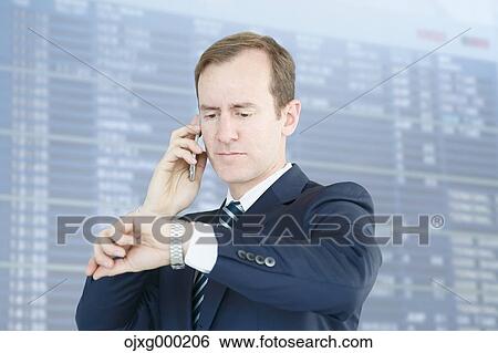 Caucasian businessman on the phone in modern office View Large Photo Image Stock Photograph - Caucasian businessman on the phone in modern office. Fotosearch