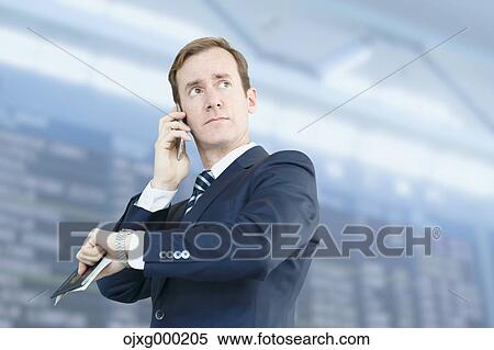 Caucasian businessman on the phone in modern office View Large Photo Image Stock Photography - Caucasian businessman on the phone in modern office. Fotosearch
