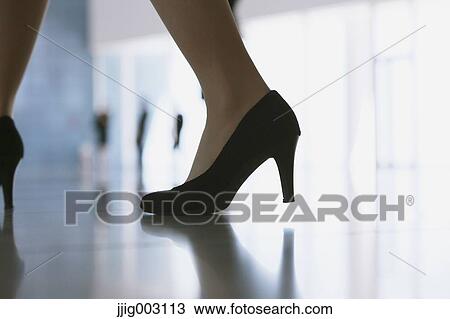 Close-up of businesswoman legs View Large Photo Image Stock Image - Close-up of businesswoman legs. Fotosearch