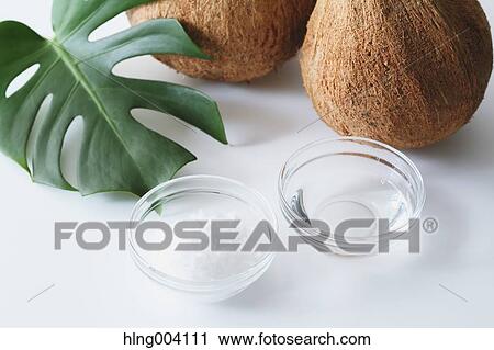 Stock Image - Coconuts oil. Fotosearch