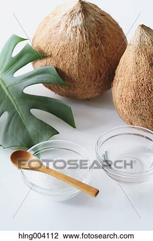Stock Image - Coconuts oil. Fotosearch