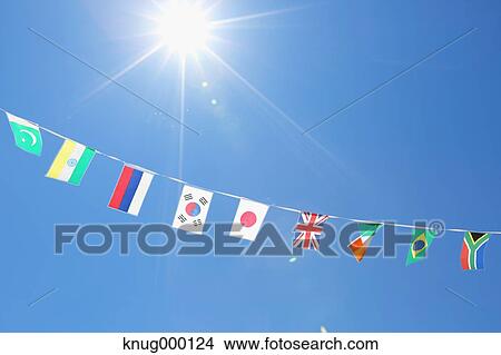 Flags in the wind View Large Photo Image Picture - Flags in the wind. Fotosearch