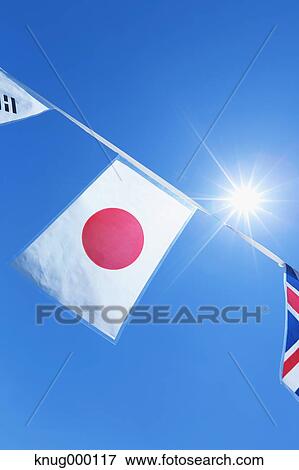 Flags in the wind View Large Photo Image Stock Photo - Flags in the wind. Fotosearch