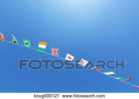 Flags in the wind View Large Photo Image Stock Photo - Flags in the wind. Fotosearch