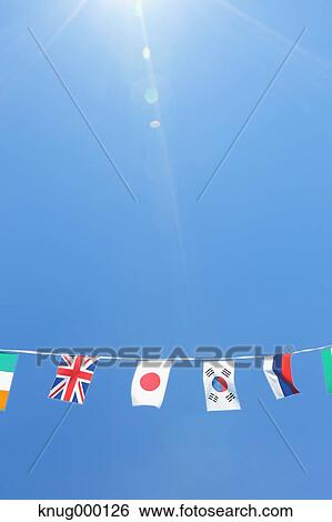 Flags in the wind View Large Photo Image Stock Photograph - Flags in the wind. Fotosearch