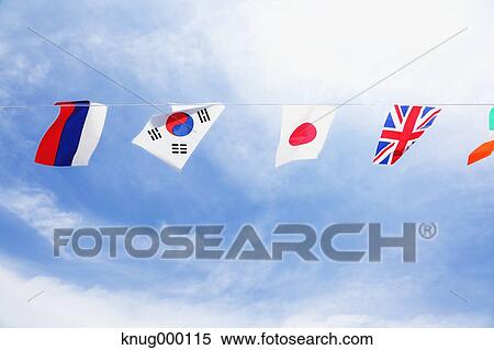 Flags in the wind View Large Photo Image Stock Photography - Flags in the wind. Fotosearch