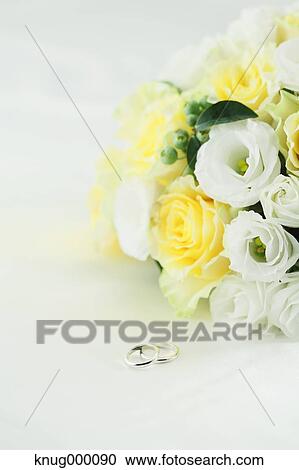 Flower bouquet and wedding rings View Large Photo Image Stock Image - Flower bouquet and wedding rings. Fotosearch