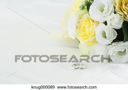 Flower bouquet and wedding rings View Large Photo Image Stock Photo - Flower bouquet and wedding rings. Fotosearch