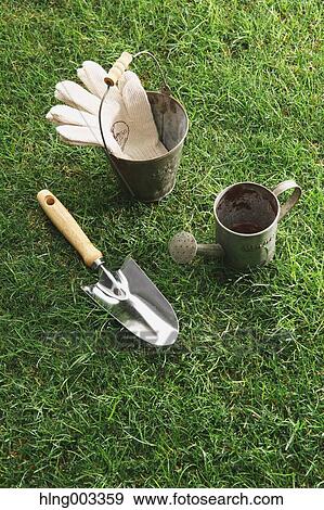Gardening tools on grass View Large Photo Image Stock Photo - Gardening tools on grass. Fotosearch