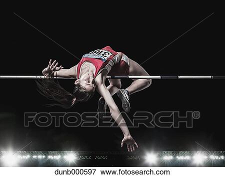 High jump female athlete View Large Photo Image Stock Photo - High jump female athlete. Fotosearch