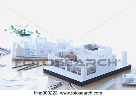 Stock Image - House miniature in an architect studio. Fotosearch