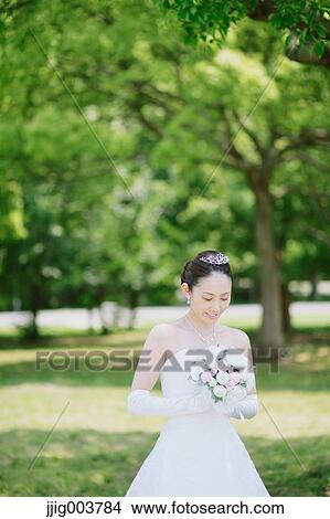 Japanese attractive bride in a city park View Large Photo Image Picture - Japanese attractive bride in a city park. Fotosearch