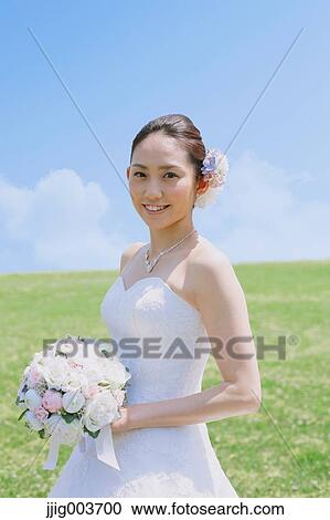 Japanese attractive bride in a city park View Large Photo Image Stock Image - Japanese attractive bride in a city park. Fotosearch