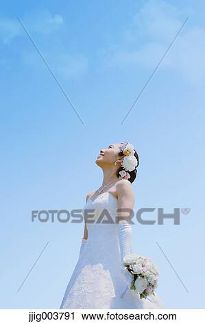 Japanese attractive bride in a city park View Large Photo Image Stock Image - Japanese attractive bride in a city park. Fotosearch