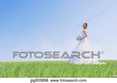 Stock Photo - Japanese attractive bride in a city park. Fotosearch