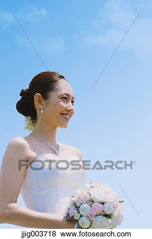 Japanese attractive bride in a city park View Large Photo Image Stock Photo - Japanese attractive bride in a city park. Fotosearch