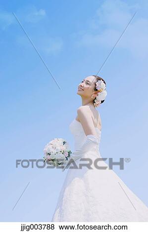 Japanese attractive bride in a city park View Large Photo Image Stock Photo - Japanese attractive bride in a city park. Fotosearch