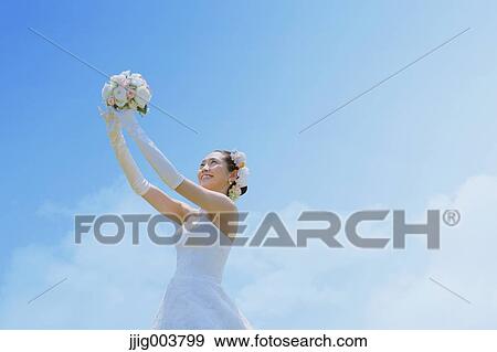 Japanese attractive bride in a city park View Large Photo Image Stock Photo - Japanese attractive bride in a city park. Fotosearch