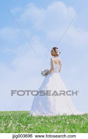 Japanese attractive bride in a city park View Large Photo Image Stock Photograph - Japanese attractive bride in a city park. Fotosearch