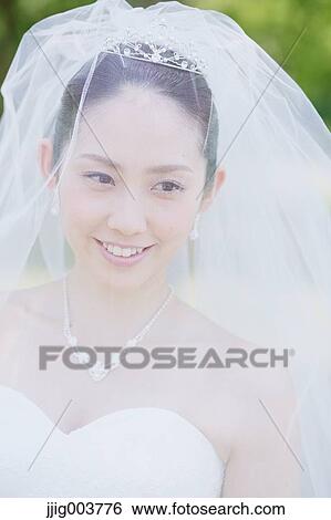 Japanese attractive bride in a city park View Large Photo Image Stock Photograph - Japanese attractive bride in a city park. Fotosearch