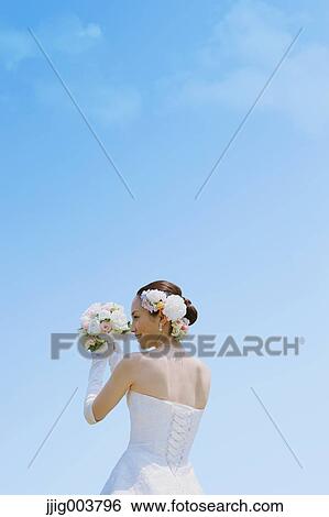 Japanese attractive bride in a city park View Large Photo Image Stock Photograph - Japanese attractive bride in a city park. Fotosearch