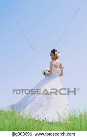 Stock Photography - Japanese attractive bride in a city park. Fotosearch