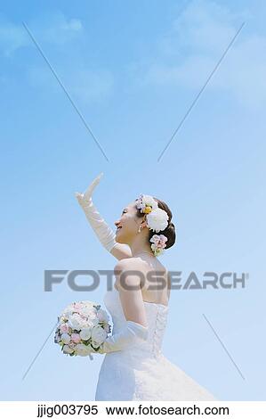 Japanese attractive bride in a city park View Large Photo Image Stock Photography - Japanese attractive bride in a city park. Fotosearch