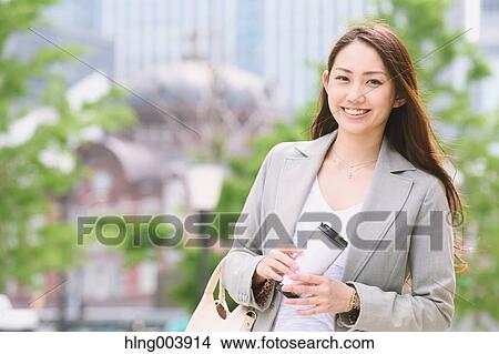 Picture - Japanese attractive businesswoman in downtown Tokyo. Fotosearch