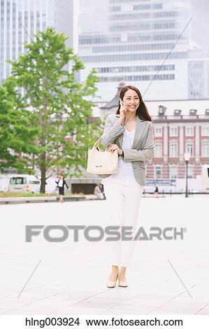 Picture - Japanese attractive businesswoman in downtown Tokyo. Fotosearch