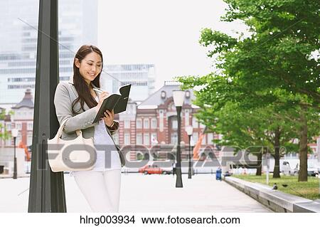 Japanese attractive businesswoman in downtown Tokyo View Large Photo Image Picture - Japanese attractive businesswoman in downtown Tokyo. Fotosearch
