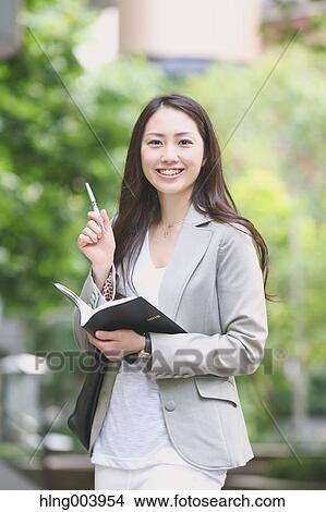 Picture - Japanese attractive businesswoman in downtown Tokyo. Fotosearch