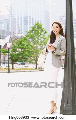 Japanese attractive businesswoman in downtown Tokyo View Large Photo Image Stock Image - Japanese attractive businesswoman in downtown Tokyo. Fotosearch