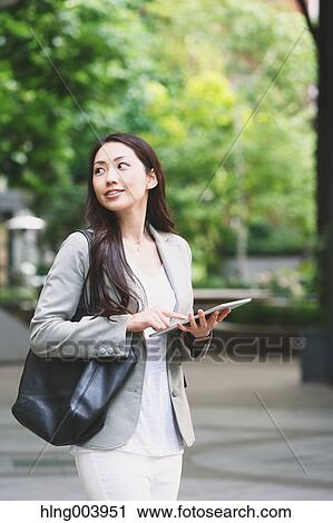 Japanese attractive businesswoman in downtown Tokyo View Large Photo Image Stock Image - Japanese attractive businesswoman in downtown Tokyo. Fotosearch
