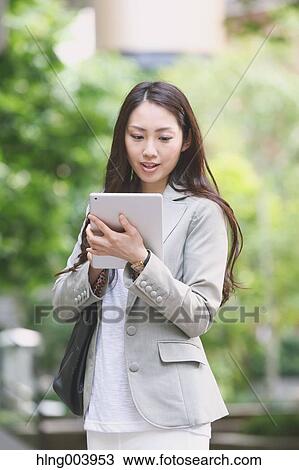 Japanese attractive businesswoman in downtown Tokyo View Large Photo Image Stock Image - Japanese attractive businesswoman in downtown Tokyo. Fotosearch
