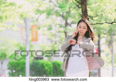 Japanese attractive businesswoman in downtown Tokyo View Large Photo Image Stock Image - Japanese attractive businesswoman in downtown Tokyo. Fotosearch