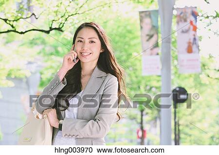 Japanese attractive businesswoman in downtown Tokyo View Large Photo Image Stock Image - Japanese attractive businesswoman in downtown Tokyo. Fotosearch