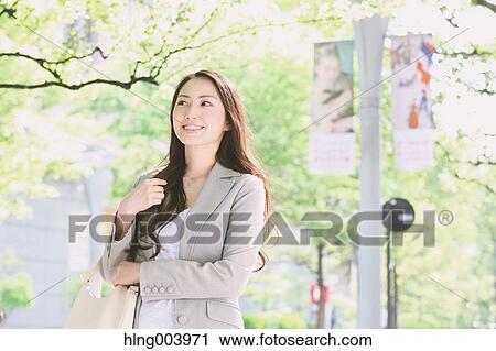 Japanese attractive businesswoman in downtown Tokyo View Large Photo Image Stock Image - Japanese attractive businesswoman in downtown Tokyo. Fotosearch
