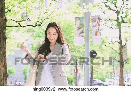 Japanese attractive businesswoman in downtown Tokyo View Large Photo Image Stock Image - Japanese attractive businesswoman in downtown Tokyo. Fotosearch