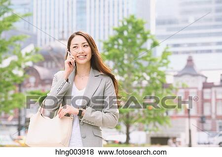 Stock Photo - Japanese attractive businesswoman in downtown Tokyo. Fotosearch