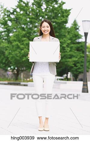 Stock Photo - Japanese attractive businesswoman in downtown Tokyo. Fotosearch