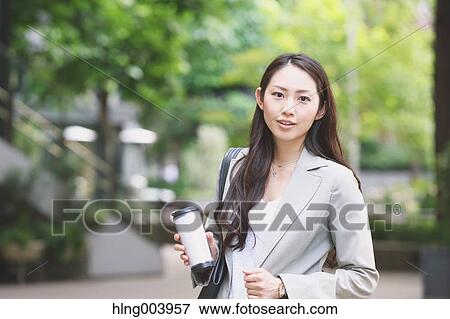 Stock Photo - Japanese attractive businesswoman in downtown Tokyo. Fotosearch