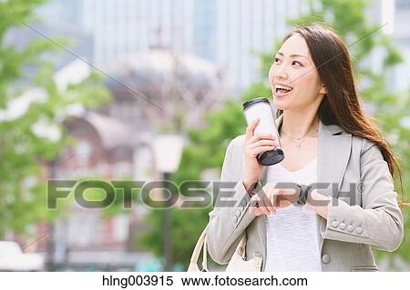 Stock Photography - Japanese attractive businesswoman in downtown Tokyo. Fotosearch