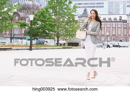 Stock Photography - Japanese attractive businesswoman in downtown Tokyo. Fotosearch
