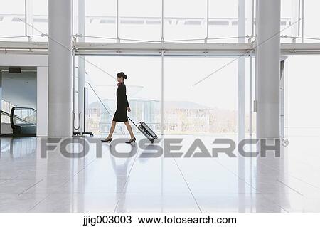 Stock Image - Japanese attractive flight attendant at the airport. Fotosearch