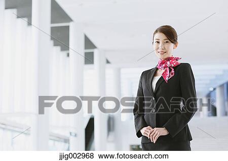 Stock Photo - Japanese attractive flight attendant at the airport. Fotosearch