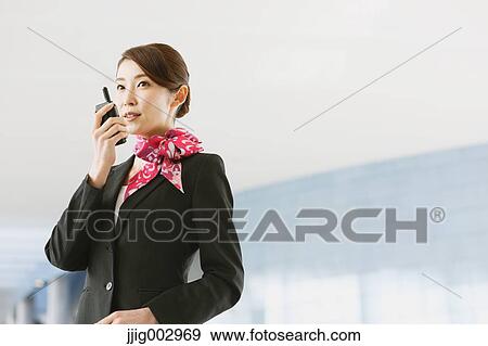 Stock Photo - Japanese attractive flight attendant at the airport. Fotosearch