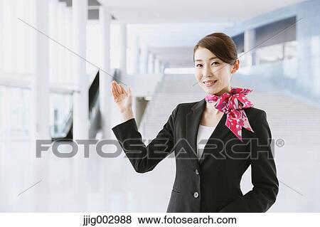 Stock Photo - Japanese attractive flight attendant at the airport. Fotosearch