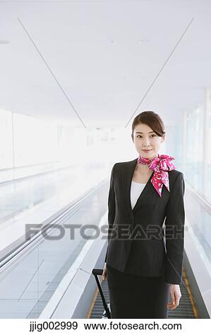 Japanese attractive flight attendant at the airport View Large Photo Image Stock Photo - Japanese attractive flight attendant at the airport. Fotosearch