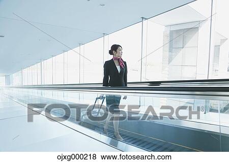 Stock Photo - Japanese attractive flight attendant at the airport. Fotosearch